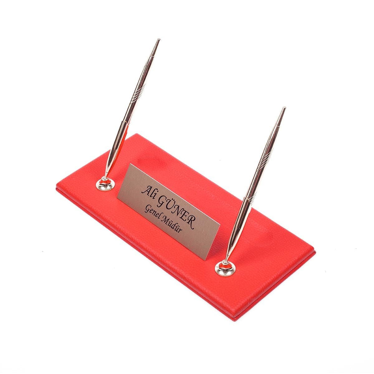 Red desk nameplate base with two silver-tone pens and a personalized silver-tone plate