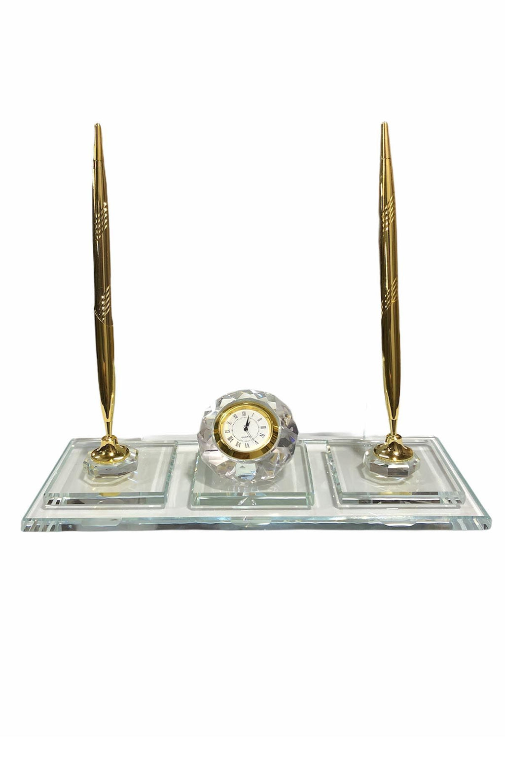 Clear desk nameplate on a transparent rectangular base with two gold-colored pens and a central round clock, viewed from the reverse side.