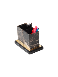 Dark marble-pattern divided pen holder with gold-colored trim, shown holding colorful stationery.