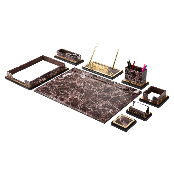 Brown marble-pattern desk accessories with a writing pad, document tray, gold-colored pen stand and stationery holders.