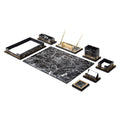 Gray and black marble-pattern desk accessories with a writing pad, document tray, gold-colored pen stand and small holders.